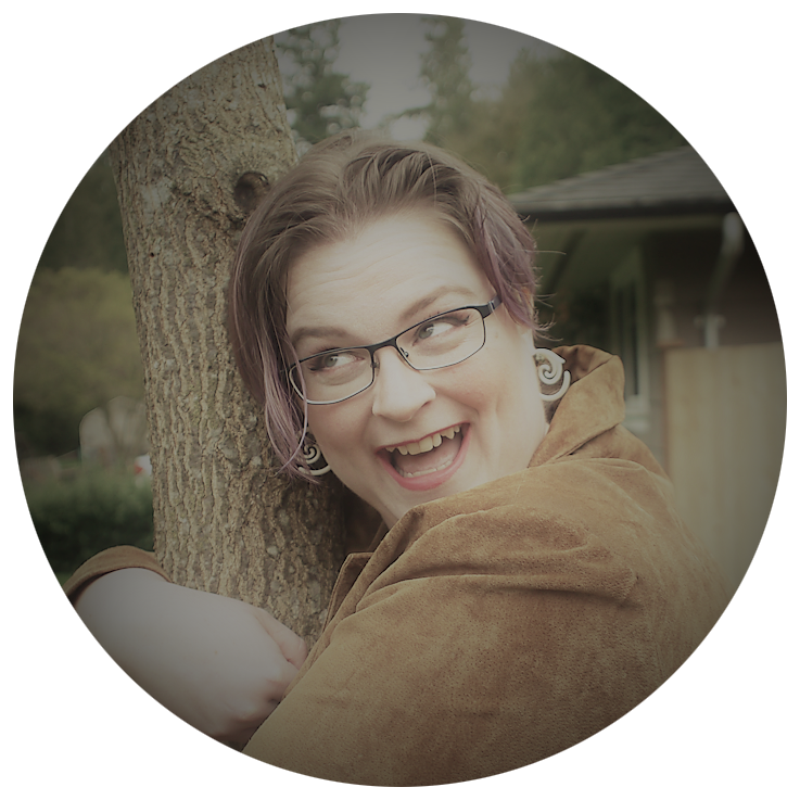 A smiling woman is gleefully hugging a tree